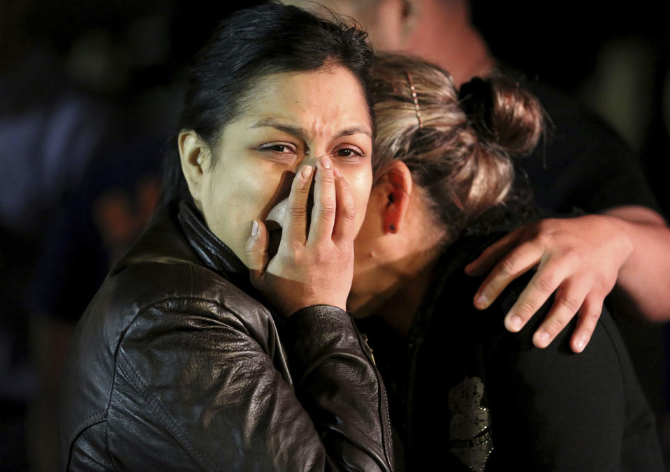 <p>The mother of 18-year-old Subway employee Javier Flores cries with family and friends at the vigil prepared for Flores Thursday, Feb. 23, 2017, in Houston. Houston police say Flores was fatally shot as he tried to protect his mother during an attempted robbery Wednesday night at the sandwich shop store. The robbers fled empty-handed. (Photo: Yi-Chin Lee/Houston Chronicle via AP) </p>