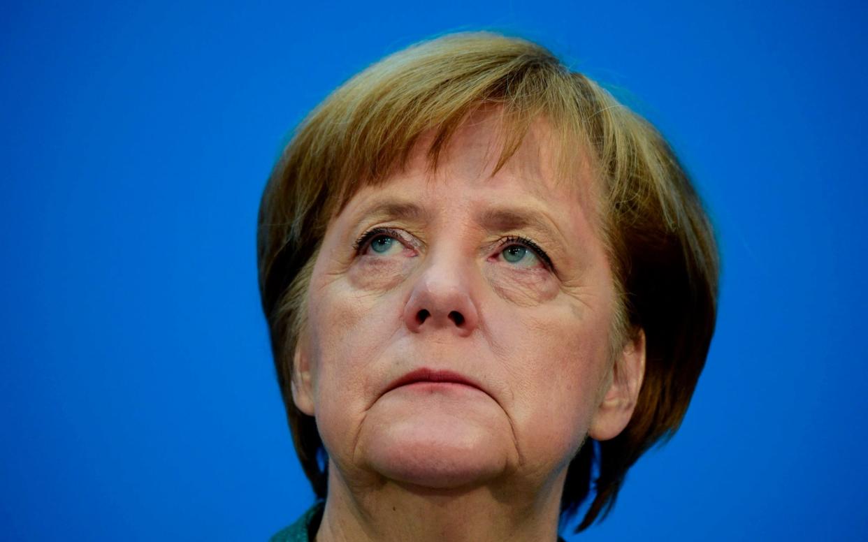 Angela Merkel is under mounting pressure at home over her migration policy as EU leaders meet for a Brussels 'mini-summit'. - AFP