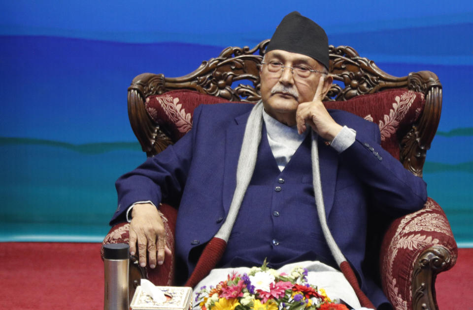 Nepalese Prime Minister Khadga Prassad Oli attends a signing of peace agreement in Kathmandu, Nepal, Friday, March 5, 2021. Leader of Nepal Communist Party group Netra Bikram Chand, who is better known by his guerrilla name Biplav, emerged out of hiding on Friday after the government lifted a ban on his group so it could take part in the public signing of the peace agreement. This group had split from the Maoist Communist party, which fought government troops between 1996 and 2006, when it gave up its armed revolt, agreed to U.N.-monitored peace talks and joined mainstream politics. (AP Photo/Niranjan Shrestha)