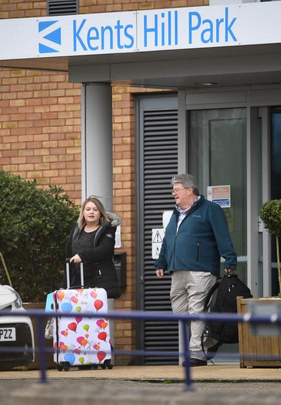 Two people get into a taxi at Kents Hill Park Training and Conference Centre in Milton Keynes (PA)