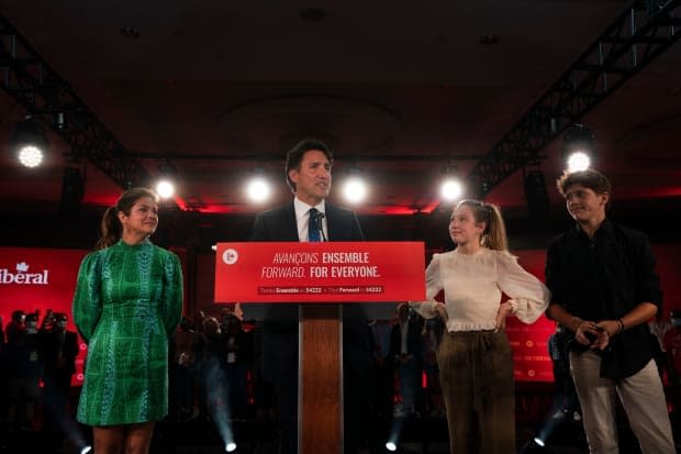 Justin Trudeau delivers his victory speech in Montreal on Sept. 21, 2021, after Liberals win a minority government. He's at the podium with wife Sophie Grégoire Trudeau, left, and their children, Ella-Grace and Xavier. (Ivanoh Demers/CBC/Radio-Canada - image credit)