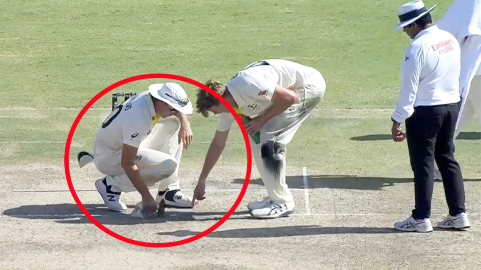 Pat Cummins, pictured here doing some work on the pitch during the second Test against Pakistan.