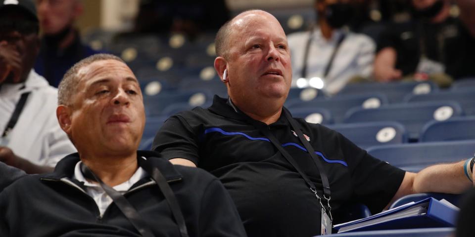 Scott Perry and Leon Rose sit in attendance at the draft combine.