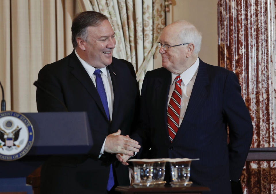Secretary of State Mike Pompeo, left, with President of the World Food Prize Foundation and former U.S. Ambassador to Cambodia, Kenneth M. Quinn, right, during the announcement of the World Food Prize Laureate at the US State Department, Monday, June 10, 2019. Simon N. Groot of the Netherlands, founder of East-West Seed, will receive the 2019 World Food Prize. (AP Photo/Pablo Martinez Monsivais)