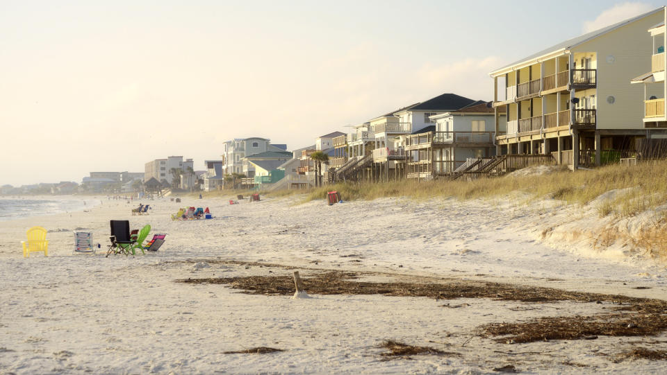 A row of vacation cottages in the sand dunes.