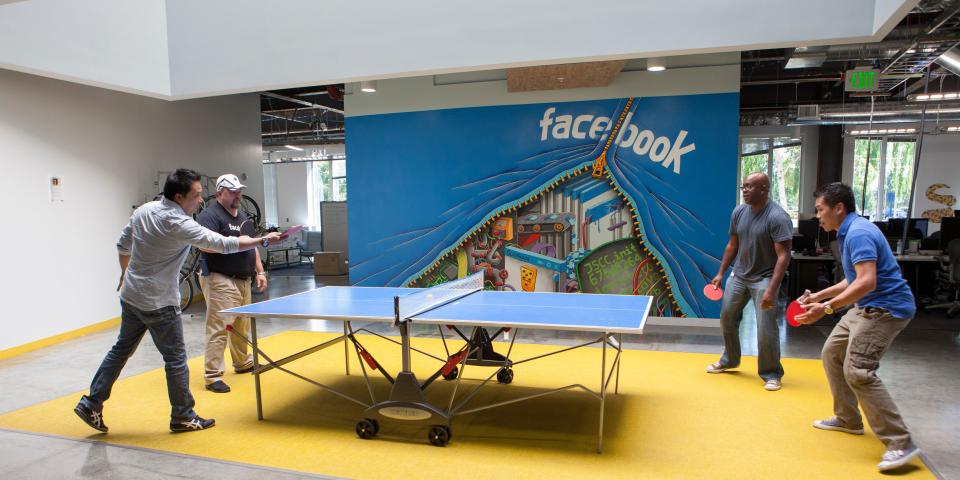 Scenes of daily work and life at Facebook , Inc. USA Headquarters in Menlo Park, California. Facebook employees relax with a game of ping-pong on campus. (Photo by Kim Kulish/Corbis via Getty Images)