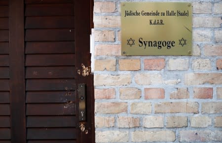 The damaged door of a synagogue is seen in Halle