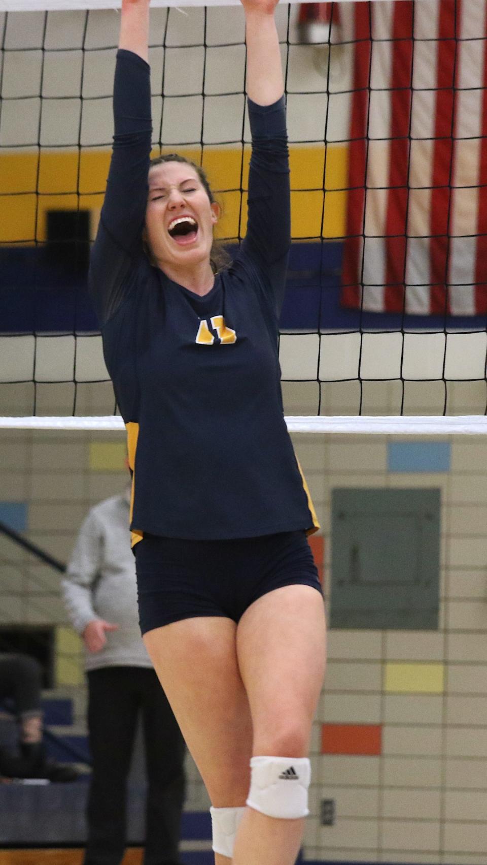 Notre Dame’s Gabby Deery (11) celebrates a winning point against Winfield-Mount Union in a Class 1A regional semifinal Monday in Burlington.
