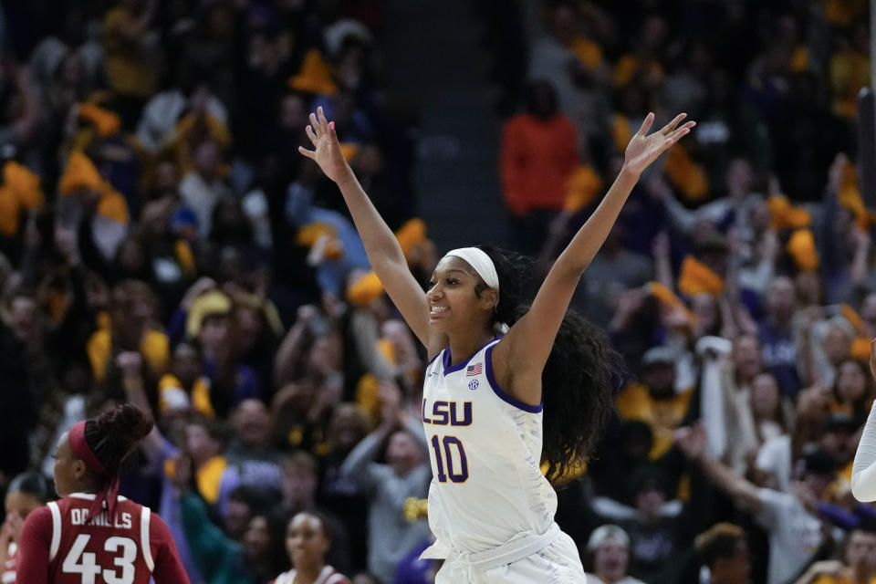 LSU forward Angel Reese (10) celebrates after defeating Arkansas in an NCAA college basketball game in Baton Rouge, La., Thursday, Jan. 19, 2023. LSU won 79-76. (AP Photo/Gerald Herbert)