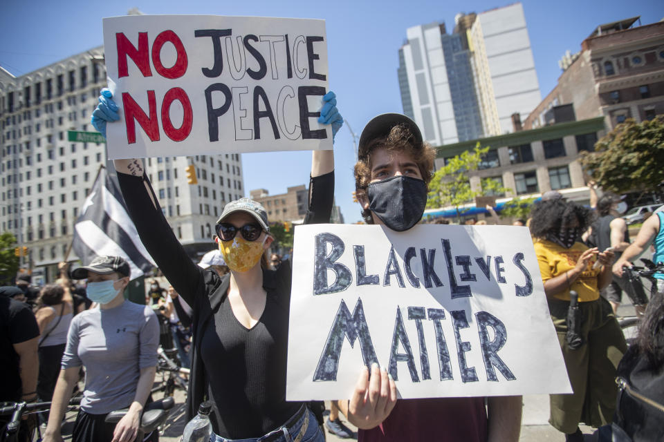 Demonstrators participate in a solidarity rally for George Floyd, Saturday, May 30, 2020, in the Harlem neighborhood of New York. Floyd died after Minneapolis police officer Derek Chauvin pressed his knee into his neck for several minutes even after he stopped moving and pleading for air. (AP Photo/Mary Altaffer)