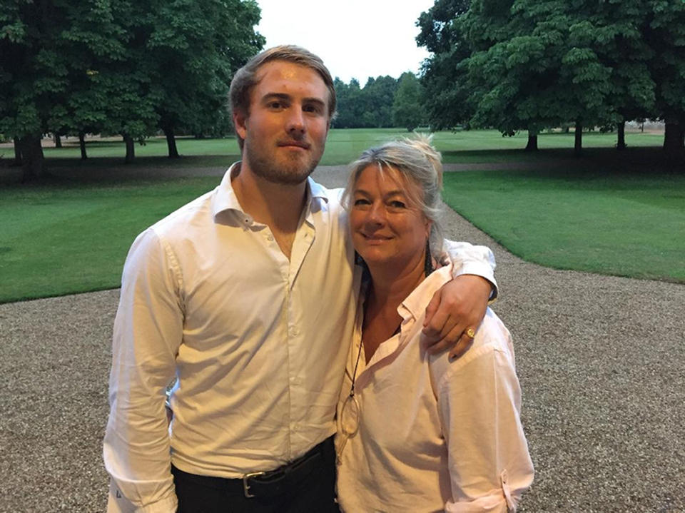 Undated family handout photo of Dominic Hamlyn, 24, with his mother Geraldine Hamlyn. The father of the "fit and healthy" Cambridge graduate who died after an underwater swimming challenge has told an inquest he had been performing the same "party trick" since he was a child.