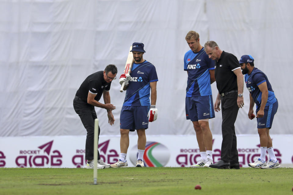 Umpires inspect the pitch as rain delays play on the third day of the second test cricket match between Bangladesh and New Zealand in Dhaka, Bangladesh, Friday, Dec. 8, 2023. (AP Photo/Mosaraf Hossain)