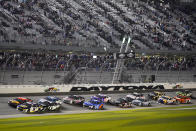 FILE - Drivers restart after a weather delay during the NASCAR Daytona 500 auto race at Daytona International Speedway, Sunday, Feb. 14, 2021, in Daytona Beach, Fla. It's another season of change for NASCAR as it prepares for Sunday's opening Daytona 500.(AP Photo/John Raoux, File)