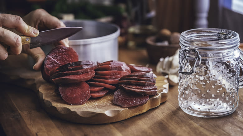 Person slicing beets