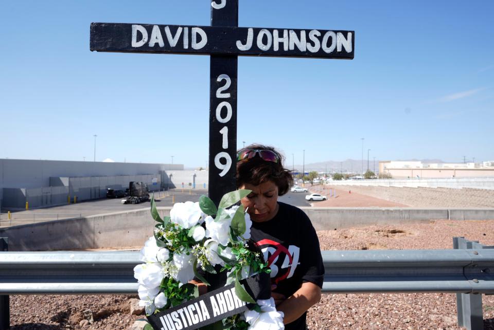 Volunteers from the Border Human Rights Network carry crosses with the names of the victims of the Aug. 3 shooting during a memorial on the fifth anniversary of the massacre.