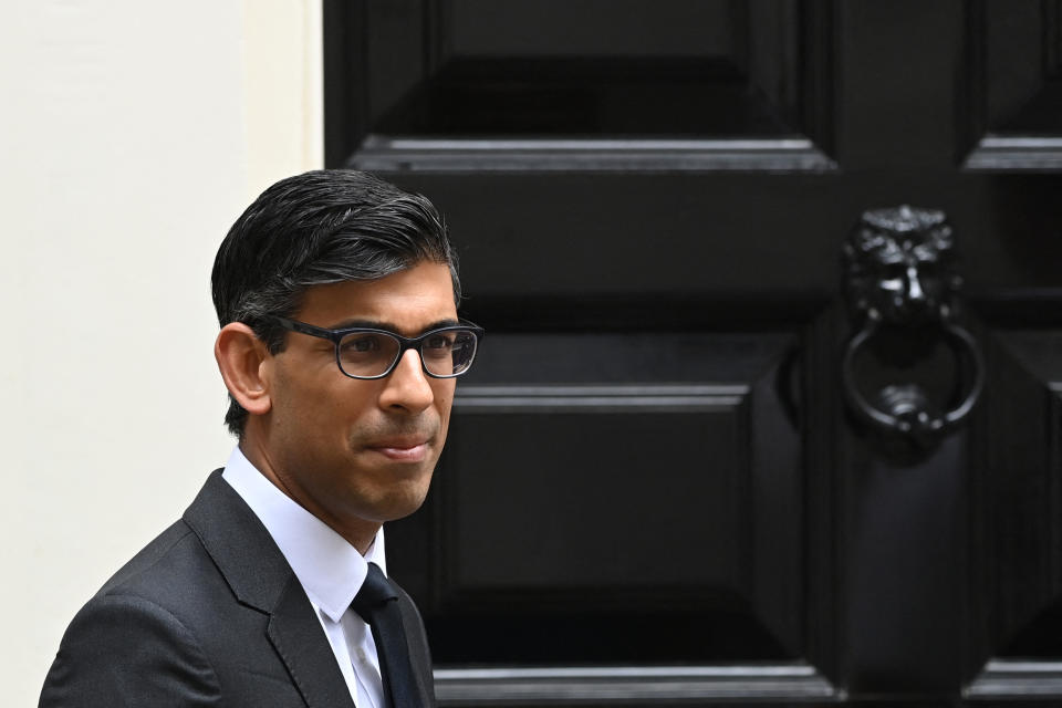 Britain&#39;s Chancellor of the Exchequer Rishi Sunak gestures outside number 11, Downing Street in central London on August 18, 2021. (Photo by Glyn KIRK / AFP) (Photo by GLYN KIRK/AFP via Getty Images)