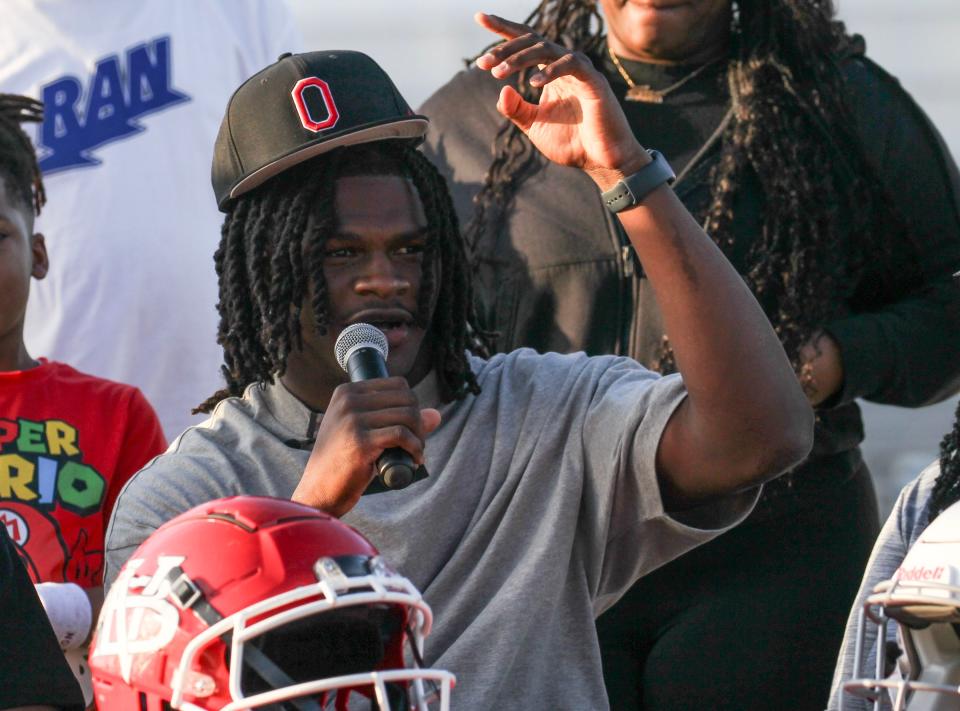 Vero Beach High School linebacker T.J. Alford announces his commitment to play football for Ohio State while sitting with his family inside the school's Citrus Bowl stadium on Saturday, March 30, 2024, in Vero Beach.
