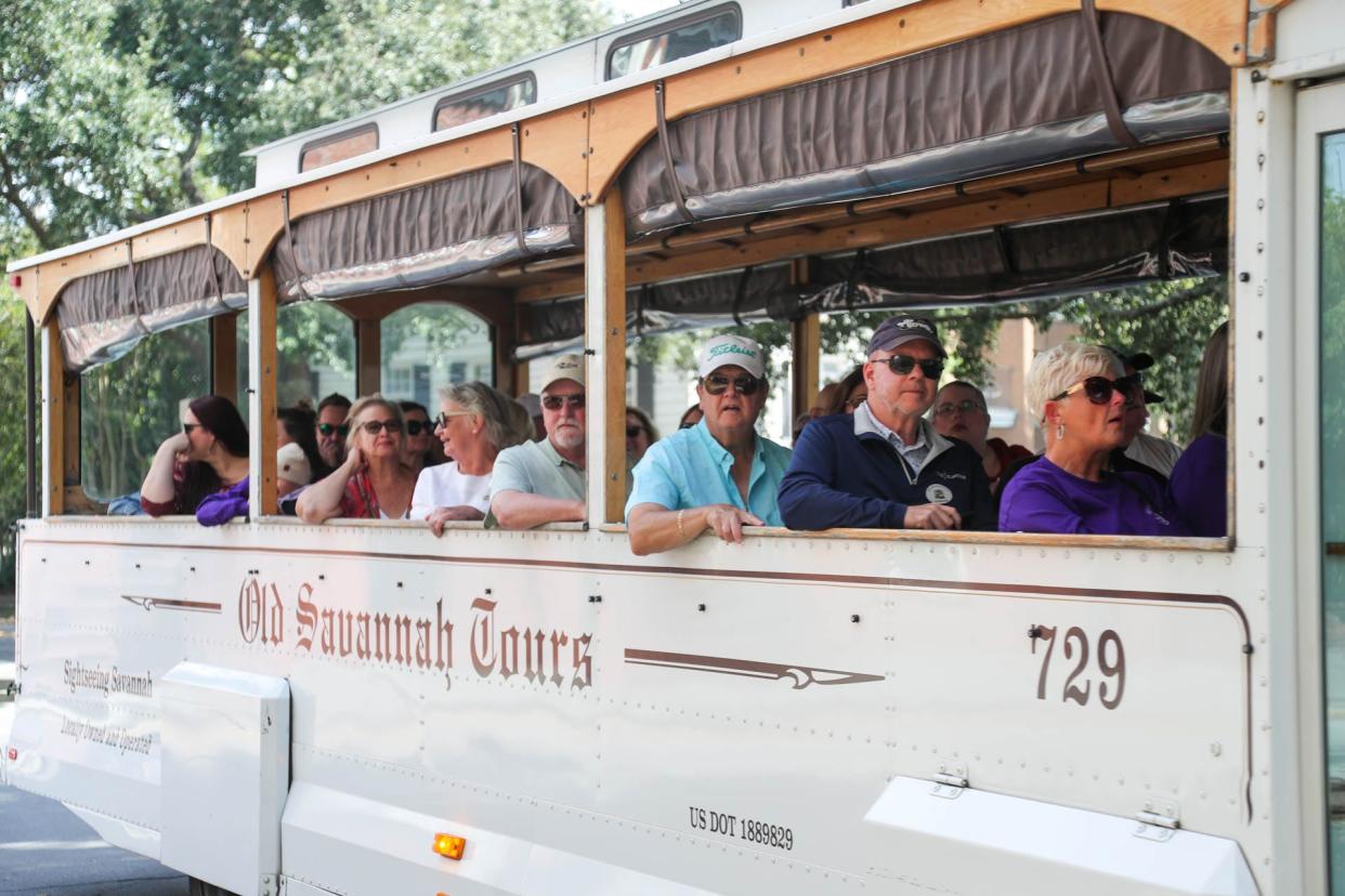 An Old Savannah Tours group makes thier way around a Square in downtown Savannah.