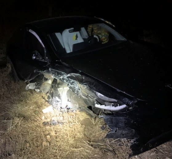 A crashed car is seen in Eaton County