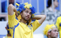 <p>A Sweden fan awaits the action </p>