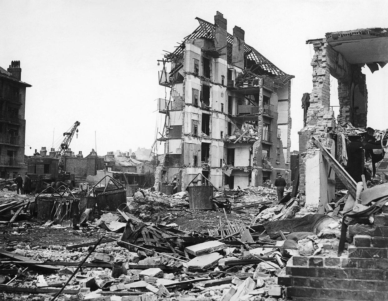 Ruined flats in Limehouse, East London. Hughes Mansions, Vallance Road, following the explosion of the last German V2 rocket to fall on London, 27 March 1945.