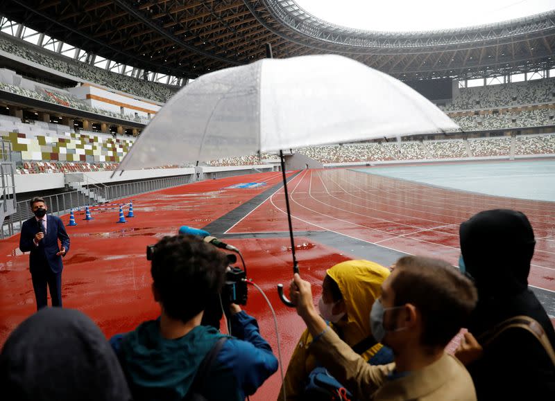 World Athletics President Sebastian Coe wearing a protective face mask speaks to media as he inspects at the National Stadium, amid the coronavirus disease (COVID-19) outbreak in Tokyo