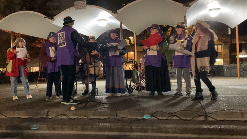 The Eugene Raging Grannies prepare to sing at a memorial vigil for the 71 people who died while homeless in Lane County in 2023.