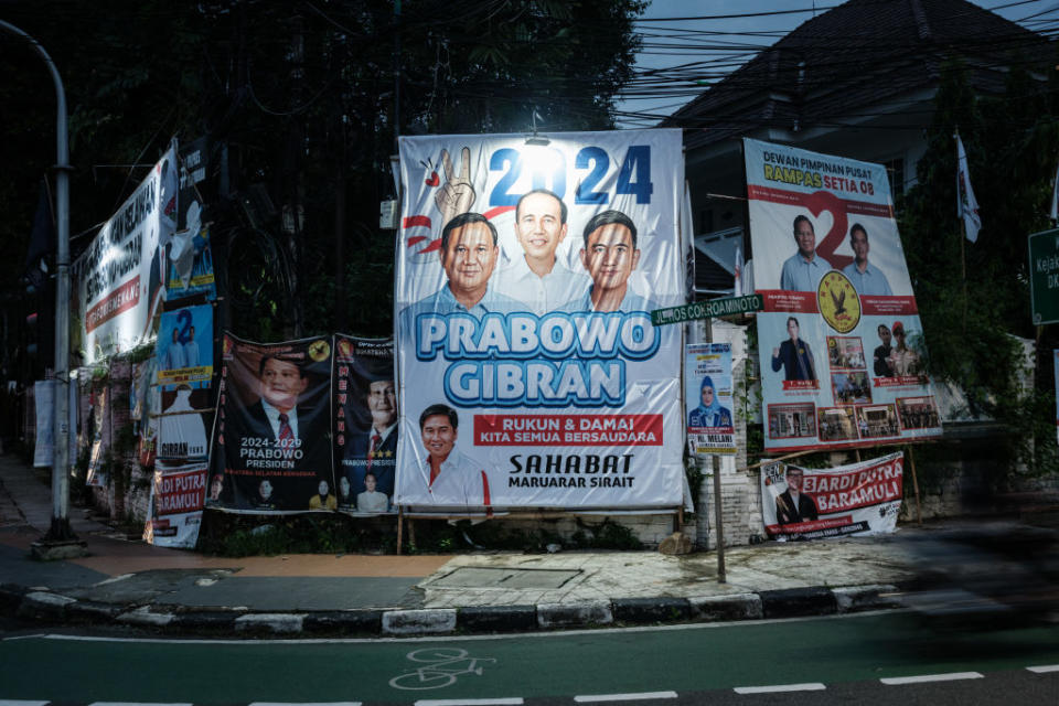 Campaign posters for Prabowo and Gibran, including one prominently featuring Jokowi, are seen along a street in Jakarta on Jan. 31, 2024.<span class="copyright">Yasuyoshi Chiba—AFP/Getty Images</span>