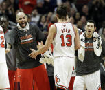 Chicago Bulls center Joakim Noah (13) celebrates with forward Carlos Boozer, left, and guard Kirk Hinrich, right, during the second half of an NBA basketball game against the Detroit Pistons in Chicago on Friday, April 11, 2014. The Bulls won 106-98. (AP Photo/Nam Y. Huh)
