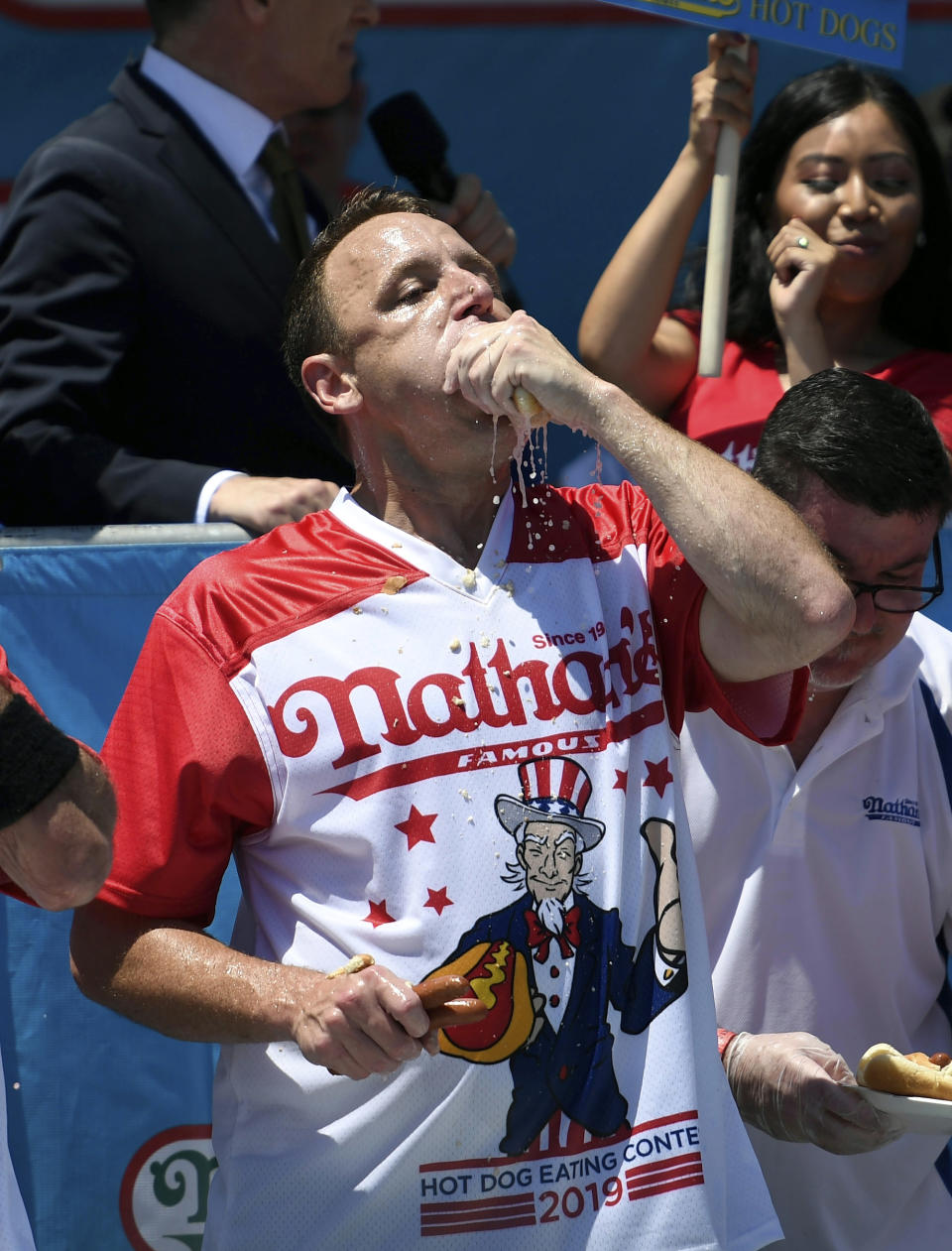 Joey Chestnut competes in the men's competition of Nathan's Famous July Fourth hot dog eating contest, Thursday, July 4, 2019, in New York's Coney Island. (AP Photo/Sarah Stier)