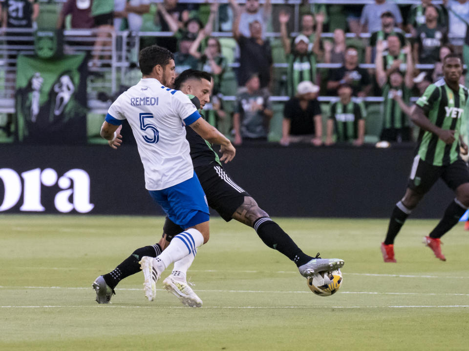 Austin FC forward Sebastián Driussi fights to control the ball against San Jose Earthquakes midfielder Eric Remedi (5) during the first half of an MLS soccer match, Saturday, Sept. 18, 2021, in Austin, Texas. (AP Photo/Michael Thomas)