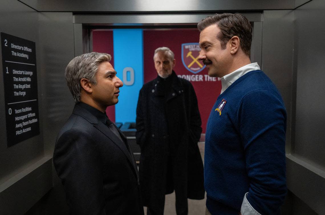 In the new season of “Ted Lasso,” Nate (Nick Mohammed, left) has left Coach Lasso (Jason Sudeikis, right) for a rival team owned by Rupert (Anthony Head).