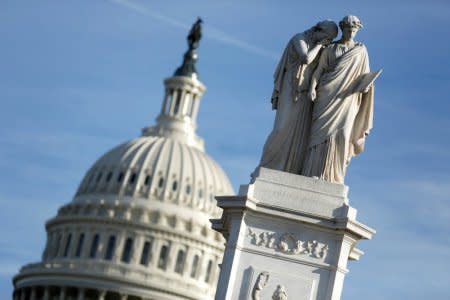 The figures of Grief and History stand on top of the Peace Statue near the U.S. Capitol after President Donald Trump and the U.S. Congress failed to reach a deal on funding for federal agencies in Washington, U.S., January 20, 2018.      REUTERS/Joshua Roberts