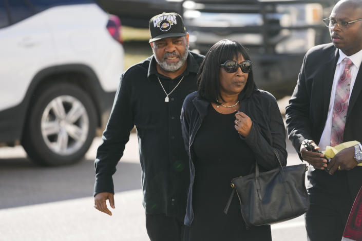 RowVaughn Wells, mother of Tyre Nichols, who died after being beaten by Memphis police officers, arrives at a news conference with Tyre's stepfather Rodney Wells, left, in Memphis, Tenn., Monday, Jan. 23, 2023. (AP Photo/Gerald Herbert)