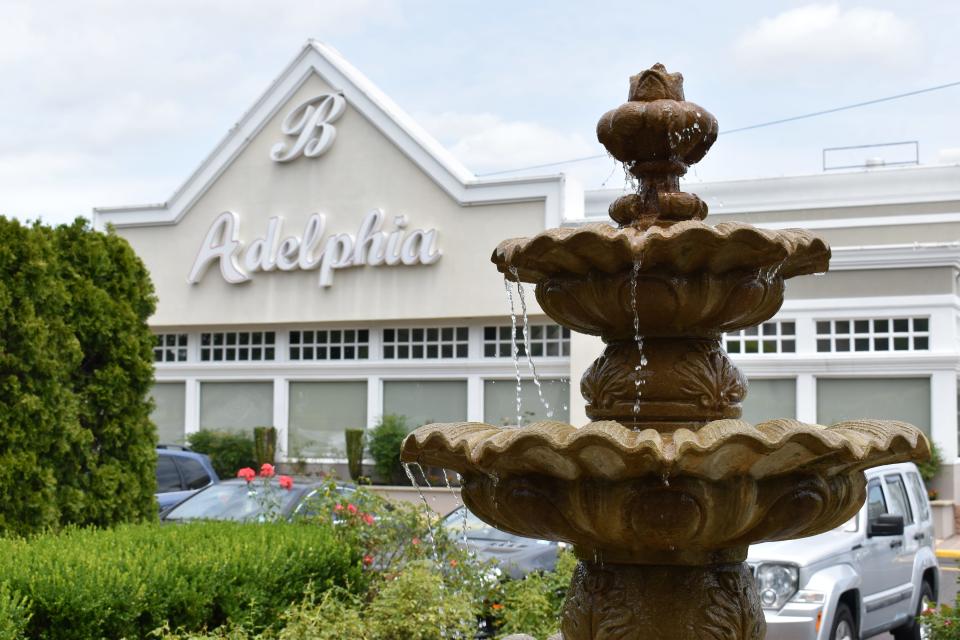 Water splashes in a fountain outside the Adelphia restaurant in Deptford.