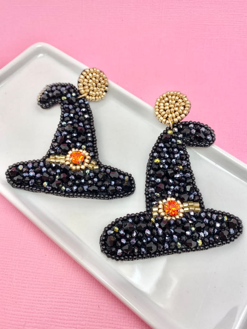 <p><a href="https://go.redirectingat.com?id=74968X1596630&url=https%3A%2F%2Fwww.etsy.com%2Flisting%2F1174625041%2Fbeaded-witch-hat-earrings-halloween&sref=https%3A%2F%2Fwww.thepioneerwoman.com%2Ffashion-style%2Fg41499386%2Fhalloween-earrings%2F" rel="nofollow noopener" target="_blank" data-ylk="slk:Shop Now;elm:context_link;itc:0;sec:content-canvas" class="link ">Shop Now</a></p><p>Beaded Witch Hat Earrings</p><p>$25.00</p><p>etsy.com</p><span class="copyright">Etsy </span>