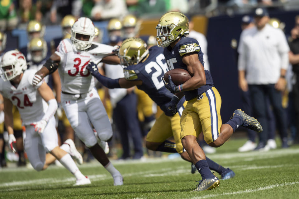 Sep 25, 2021; Chicago, Illinois; Notre Dame Fighting Irish running back Chris Tyree (25) returns a kick for a touchdown during the second half against the Wisconsin Badgers at Soldier Field. Patrick Gorski-USA TODAY Sports