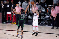 Toronto Raptors' Fred VanVleet (23) attempts a three-pointer against Boston Celtics' Grant Williams (12) during the second half of an NBA conference semifinal playoff basketball game Friday, Sept. 11, 2020, in Lake Buena Vista, Fla. The Celtics won 92-87. (AP Photo/Mark J. Terrill)