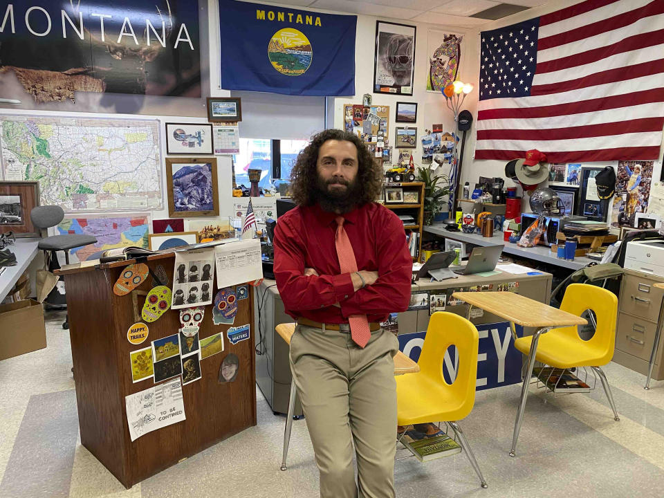 This photo provided by Chris Johnson, on Wednesday, April 21, 2021, shows Ryan Cooney, a high school social studies teacher in his classroom in Helena, Mont. The guilty verdict in the trial of former Minneapolis police Officer Derek Chauvin for the killing of George Floyd marked the latest challenge for teachers around the U.S., grappling all year with how to address the country's reckoning with racial injustice. (Chris Johnson via AP)