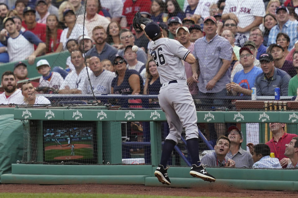 New York Yankees first baseman DJ LeMahieu can't make the play on a foul ball by Boston Red Sox's Xander Bogaerts during the first inning of a baseball game at Fenway Park, Thursday, July 22, 2021, in Boston. (AP Photo/Elise Amendola)