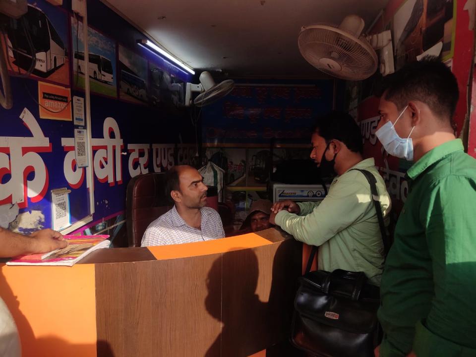 Naveen Guha, 40, attending to clients at his tour and travels shop at Delhi’s Anand Vihar Interstate Bus TerminalNamita Singh/The Independent