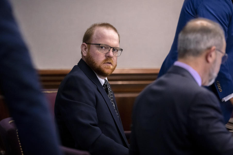 Travis McMichael sits with his attorney before the start of the trial for Ahmaud Arbery's shooting death.