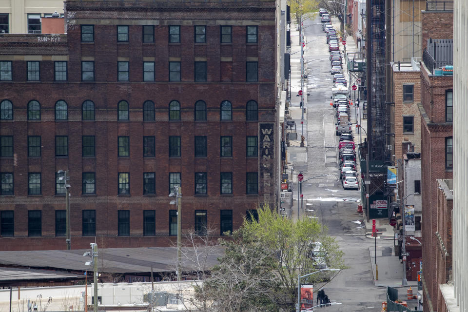 Cars are parked on an empty street during the COVID-19 outbreak in the DUMBO neighborhood of the Brooklyn borough of New York, Friday, April 10, 2020. The new coronavirus causes mild or moderate symptoms for most people, but for some, especially older adults and people with existing health problems, it can cause more severe illness or death. (AP Photo/Mary Altaffer)