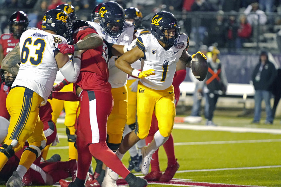 California running back Jaydn Ott (1) rushes for a 1-yard touchdown against Texas Tech during the first half of the Independence Bowl NCAA college football game Saturday, Dec. 16, 2023, in Shreveport, La. (AP Photo/Rogelio V. Solis)