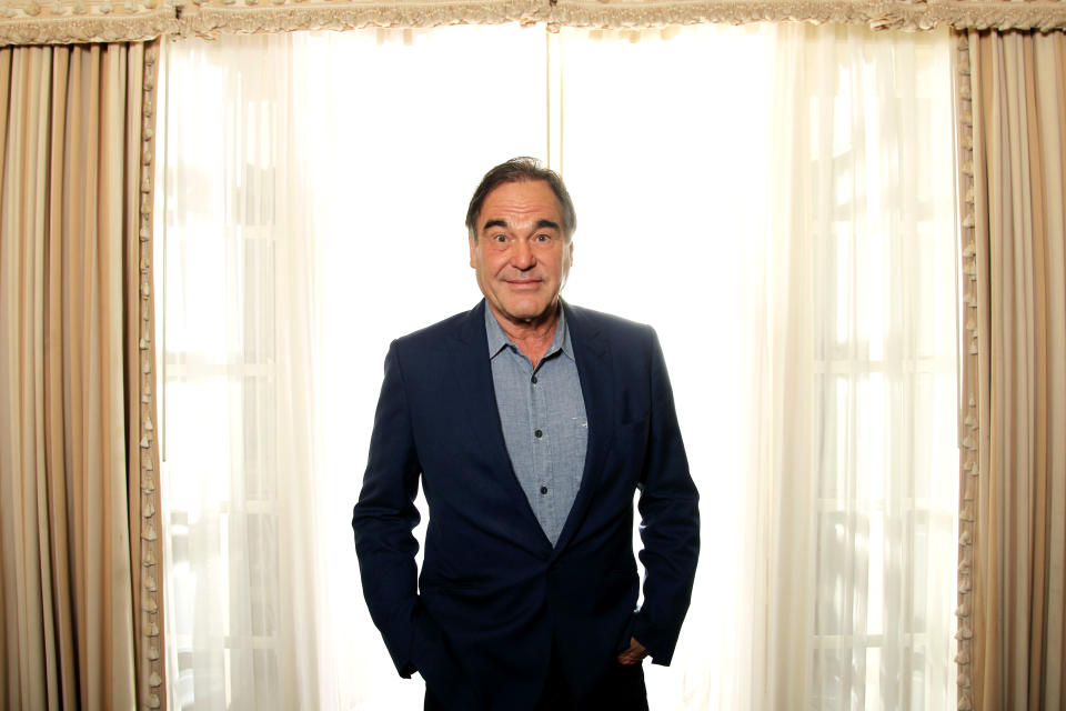 In this Friday, June 15, 2012 photo, director, Oliver Stone, poses for a portrait in Beverly Hills, Calif. Stone is taking his passion for marijuana to the big-screen with his new drug-war thriller film "Savages." (Photo by Matt Sayles/Invision/AP)