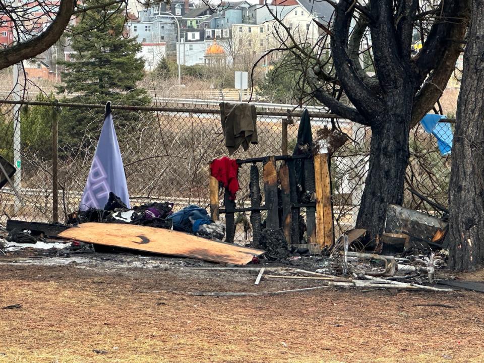 The aftermath of a fire that killed two people at a homeless encampment in Saint John this week.
