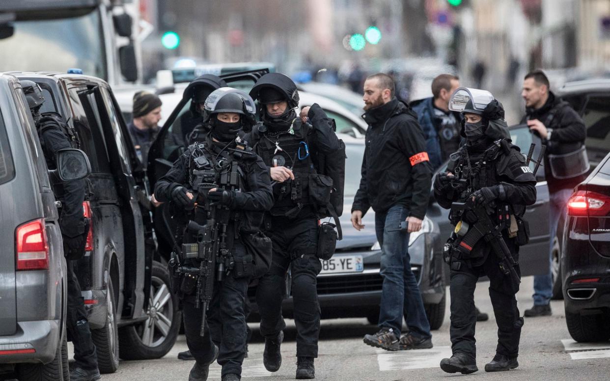 French police forces take position in the Neudorf district of Strasbourg, eastern France on Thursday, December 13 - AP