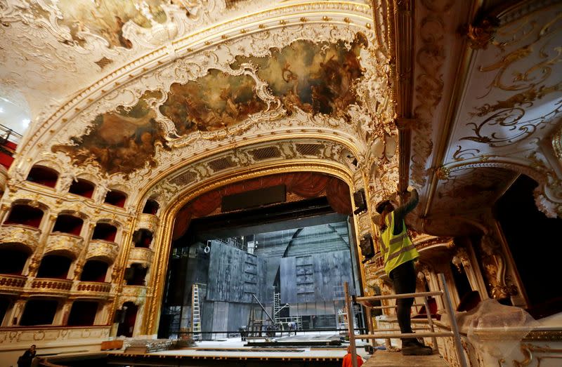 A worker is seen during a general renovation of Prague's State Opera building