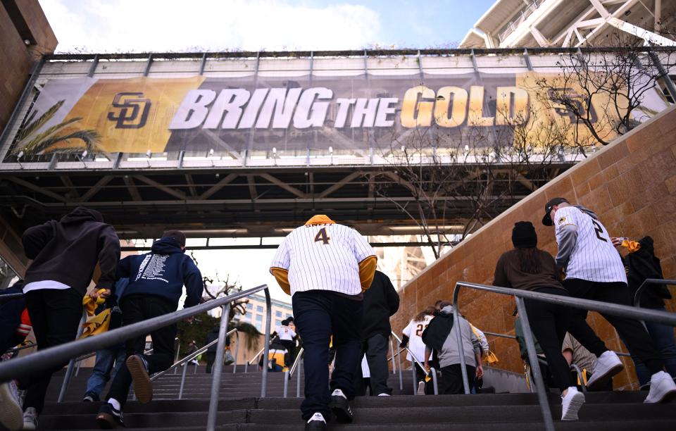 Padres fans enter Petco Park before a game on March 30.