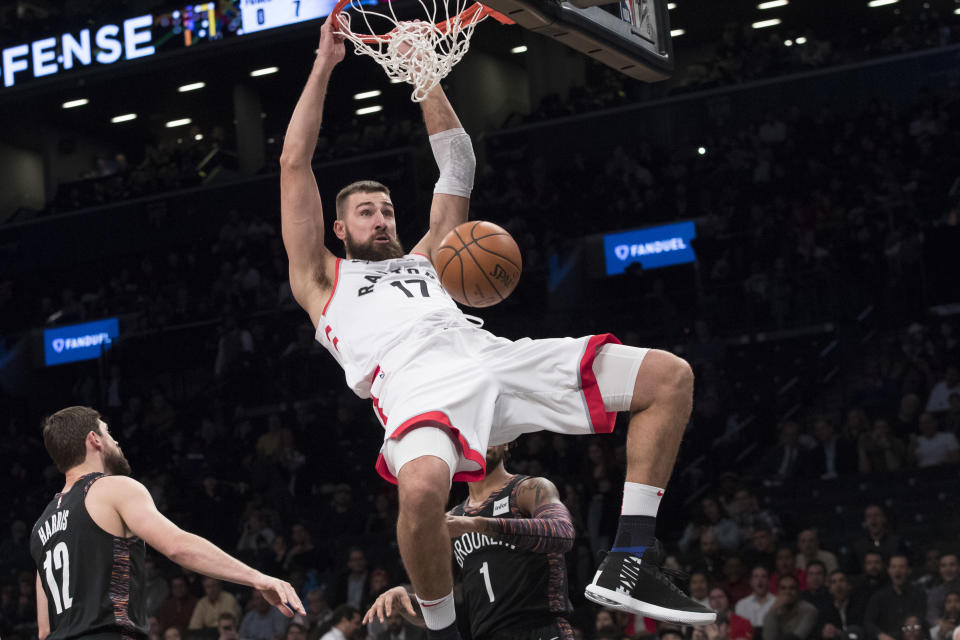 Toronto Raptors center Jonas Valanciunas dunks during the first half of an NBA basketball game against the Brooklyn Nets, Friday, Dec. 7, 2018, in New York. (AP Photo/Mary Altaffer)